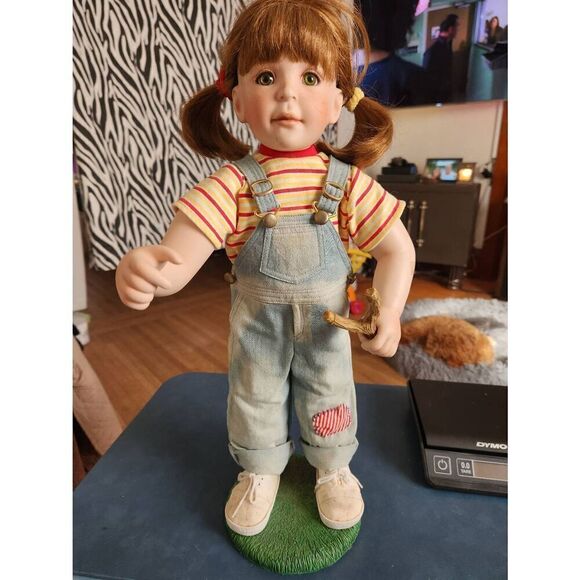 Danbury Mint Porcelain Doll by Kelly RuBert. Girl playing with slingshot in bib - Picture 1 of 2